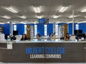 service desk with gray wood and blue & white lettering